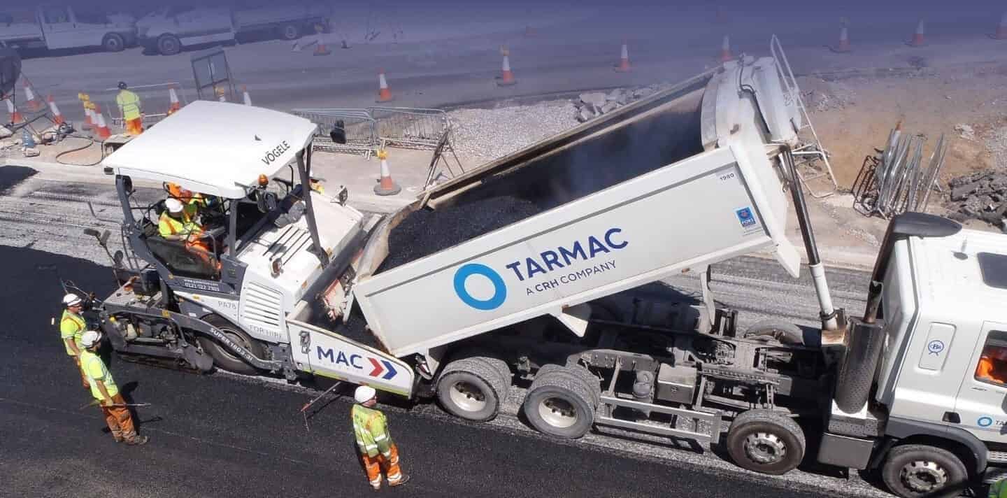 MAC surfacing crew laying asphalt as subcontractor
