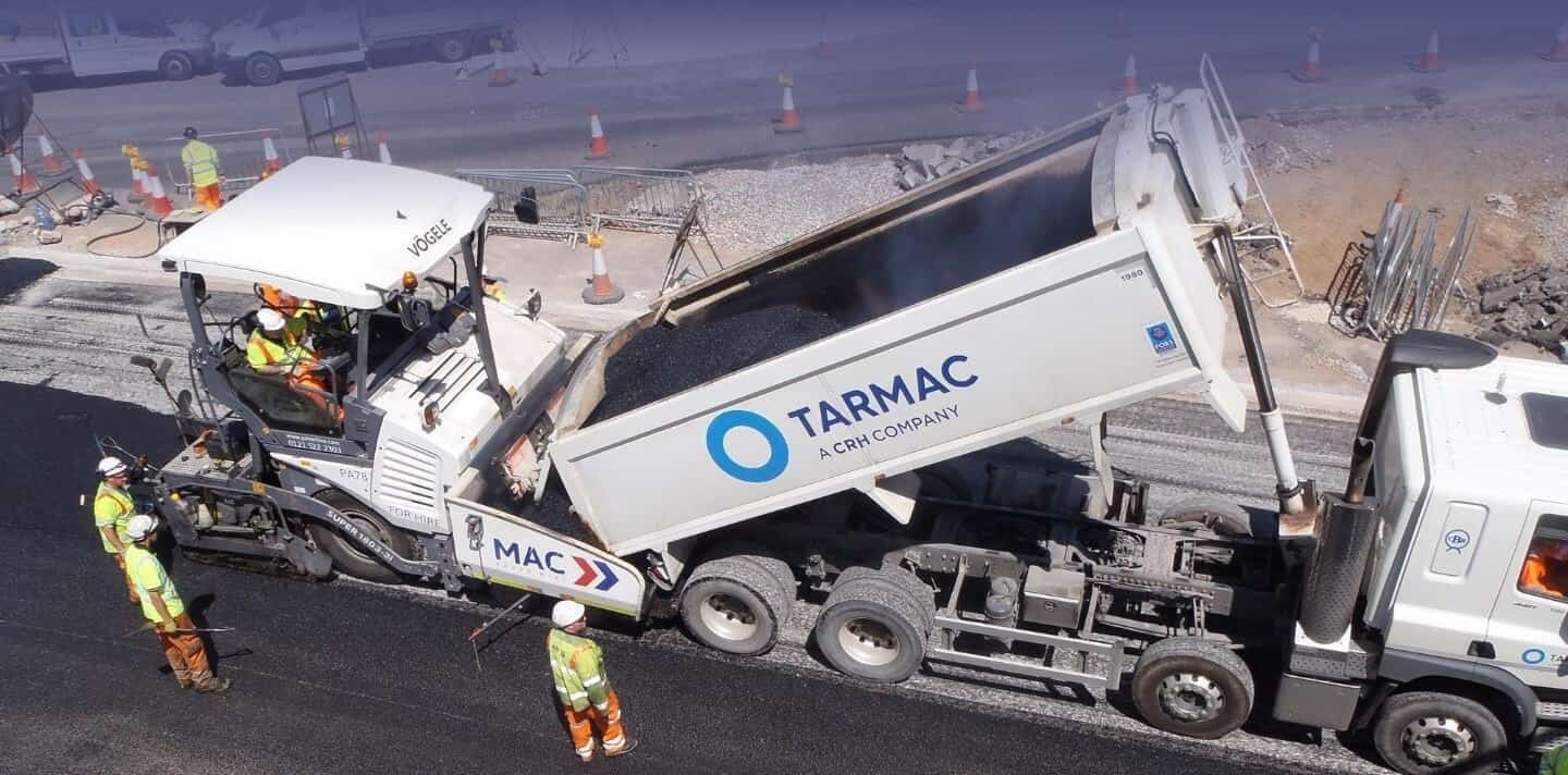 MAC surfacing crew laying asphalt as subcontractor